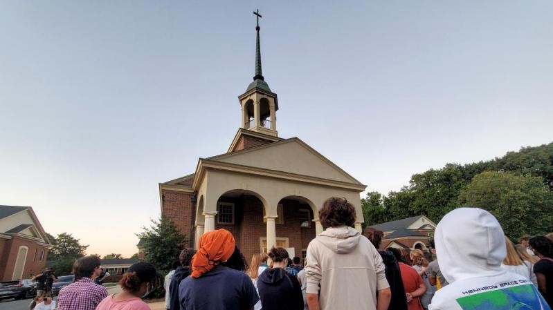 Hundreds of people gathered Thursday night in front of Mount Tabor United Methodist Church in Winston-Salem on Thursday, September 2, 2021 to pray for peace and healing after a fatal shooting at a local high school.
