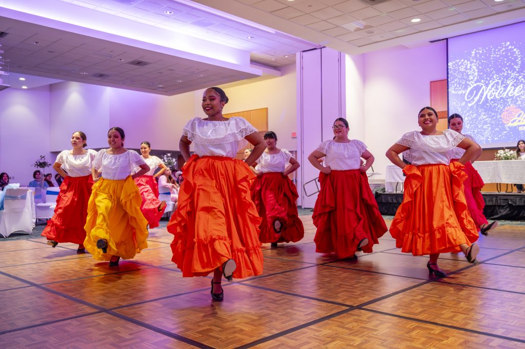 authentically dressed hispanic women dancing